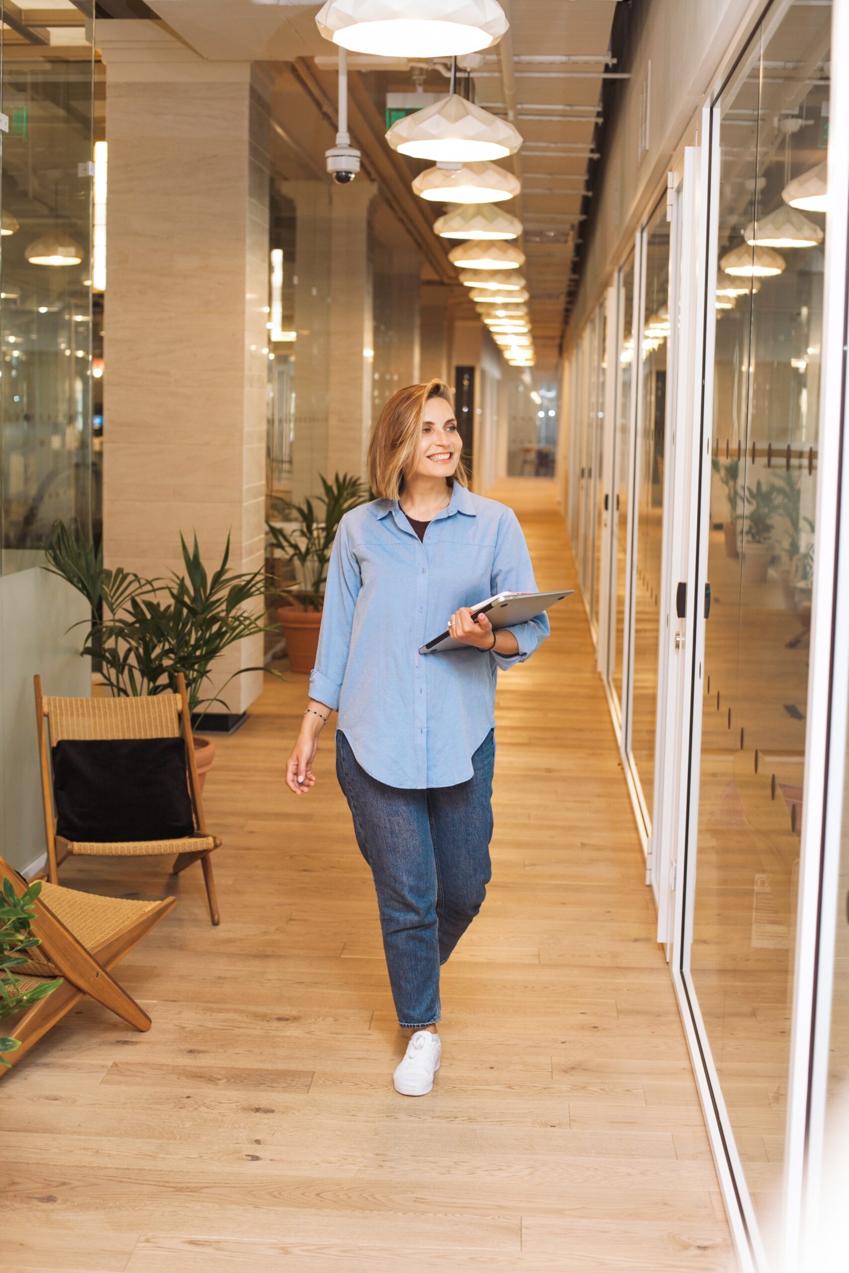 woman walking through an office