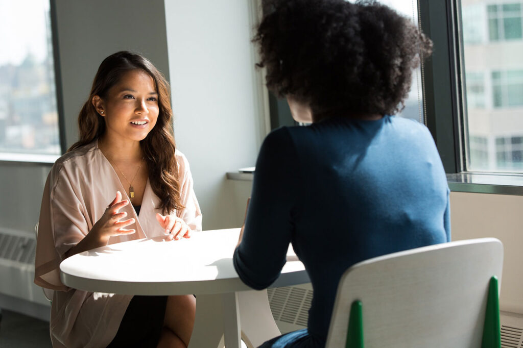 Two women talking - active or empathetic listening